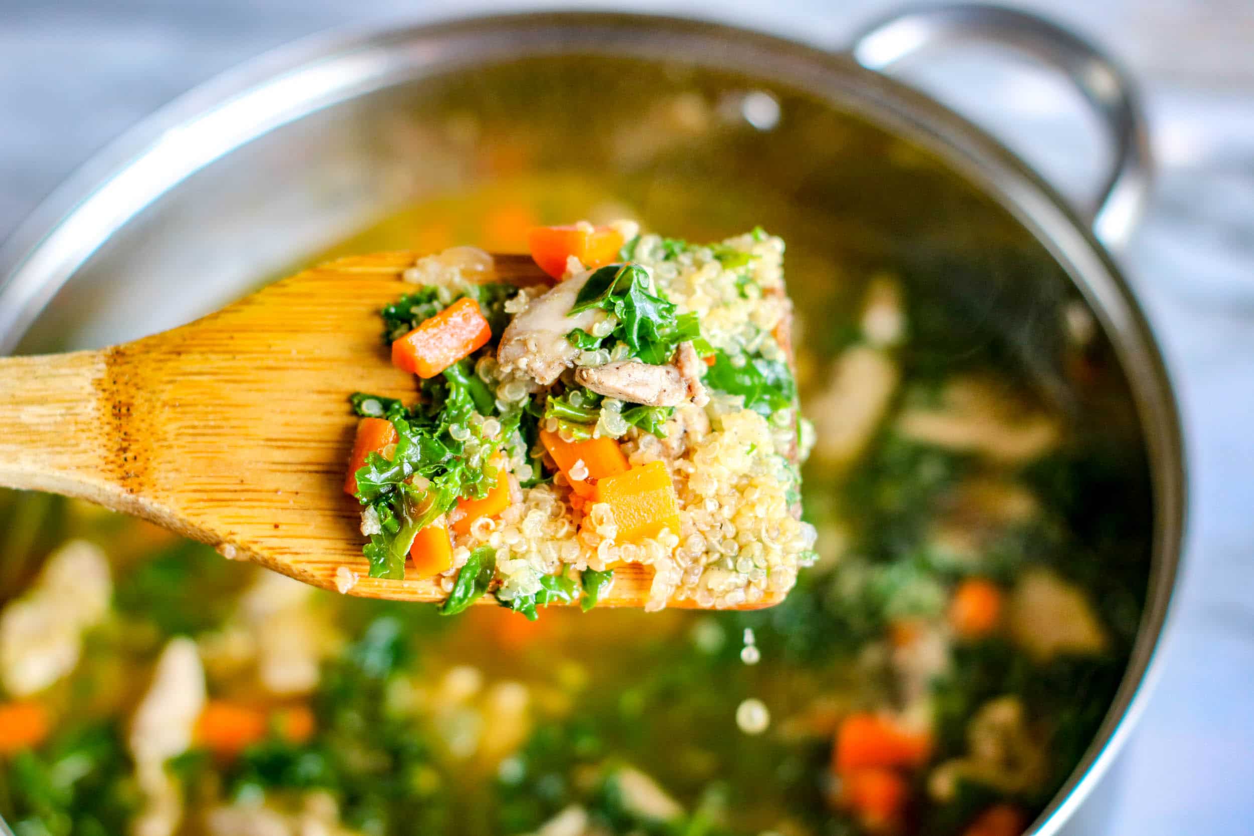 chicken kale quinoa soup close up view