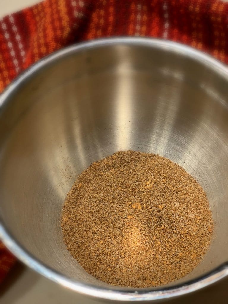 spices mixed up in a stainless steel bowl